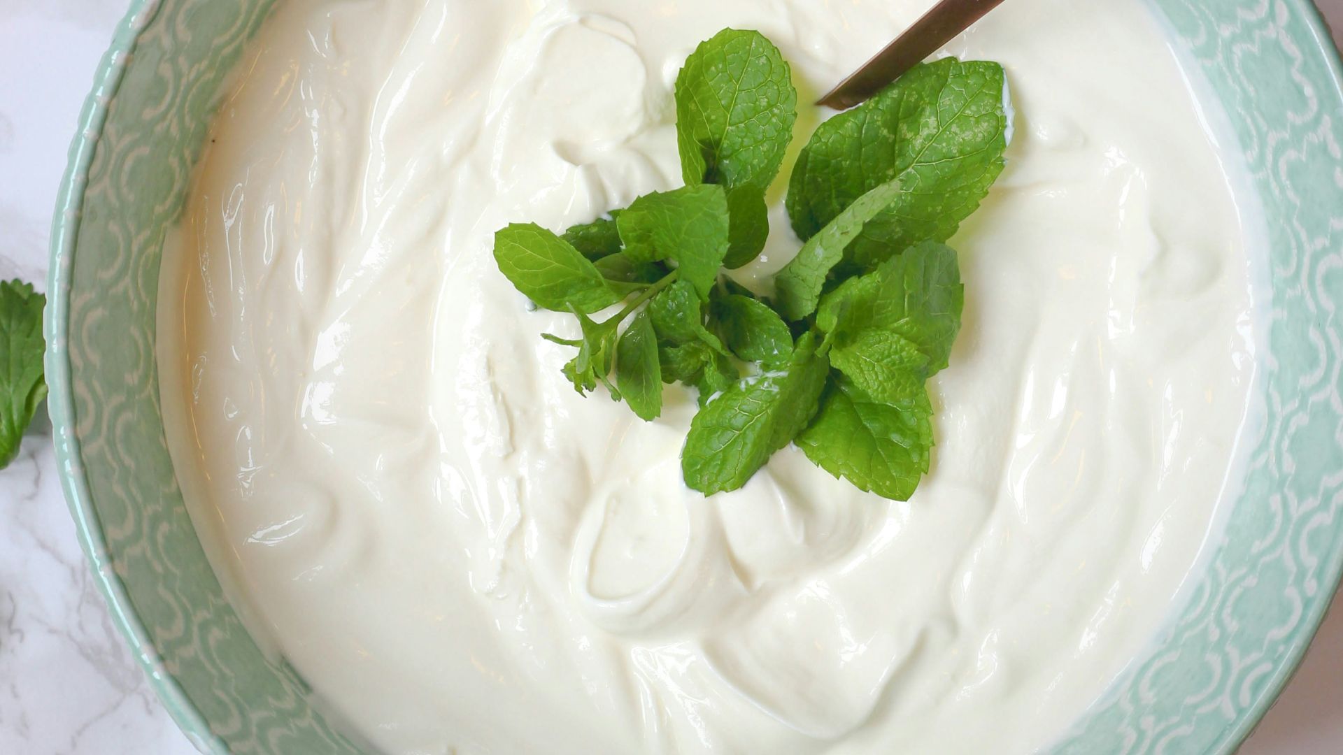 a bowl of yogurt with a spoon in it