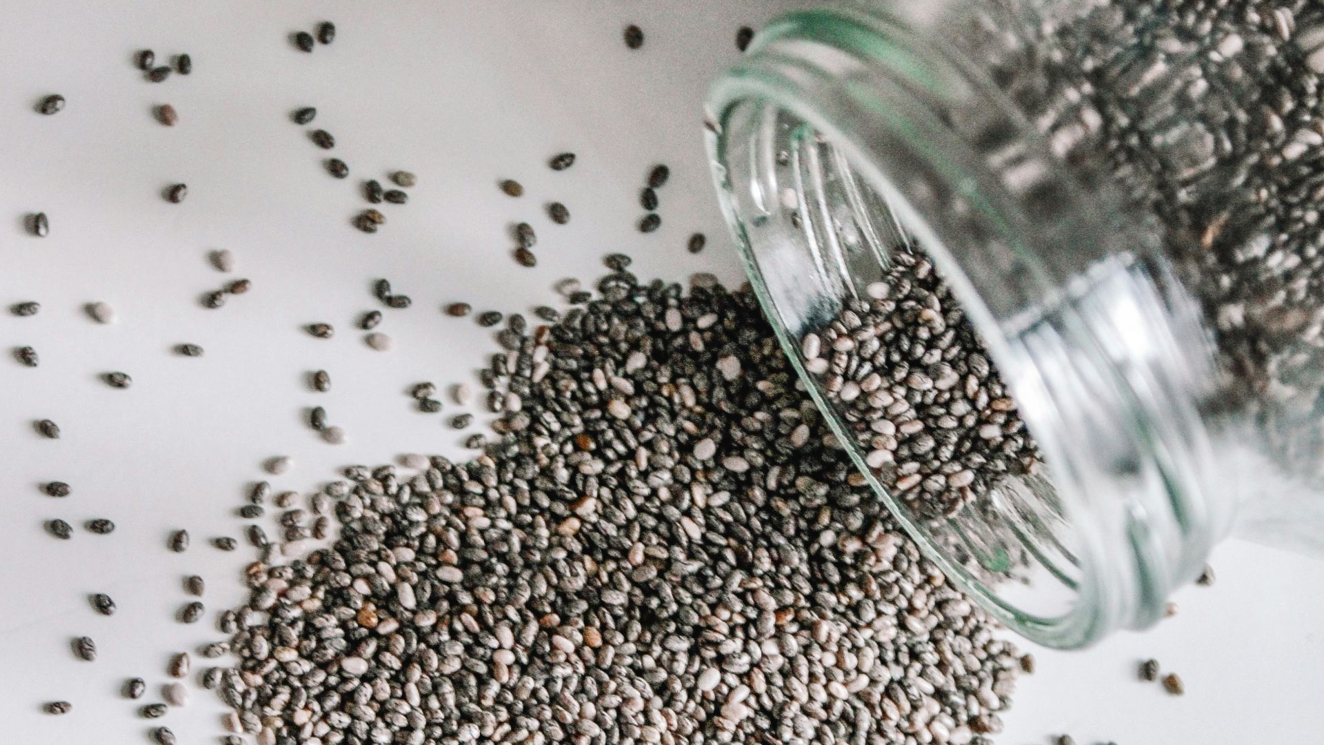 black beads in clear glass jar