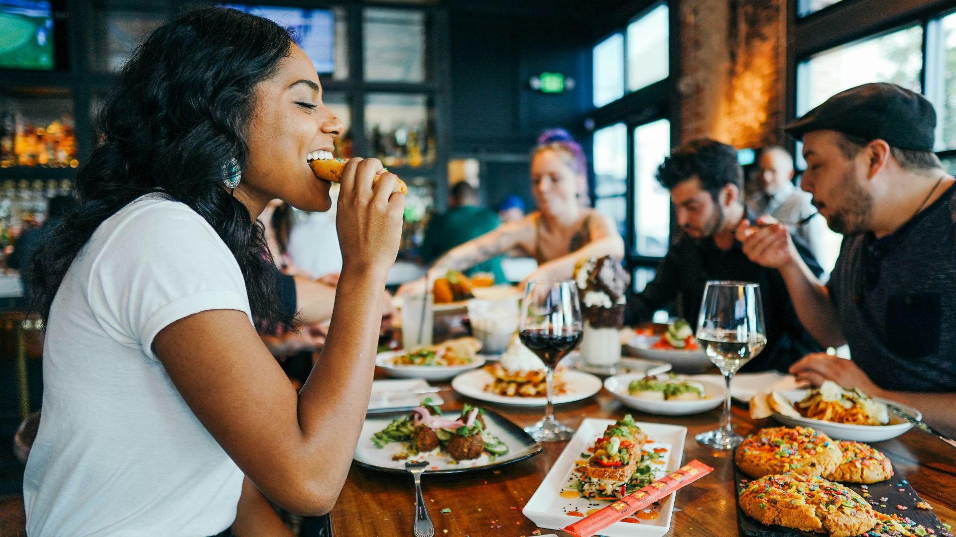 woman in white shirt eating