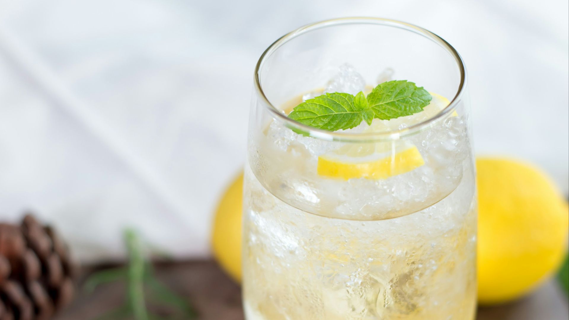 clear drinking glass with yellow liquid