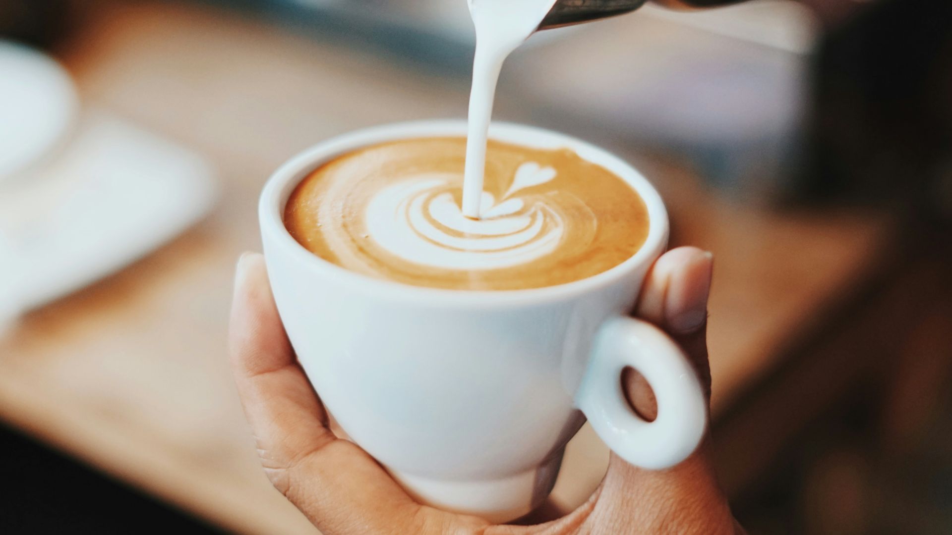 person making latte art