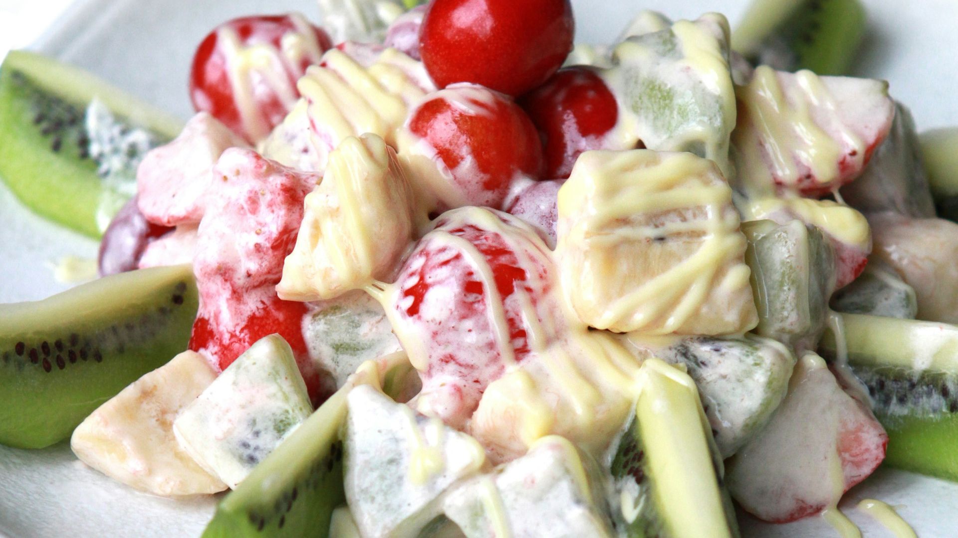 sliced fruits on white ceramic plate