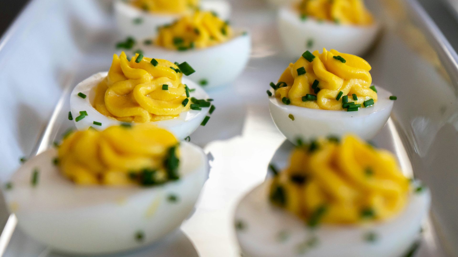 white and yellow icing covered cupcakes