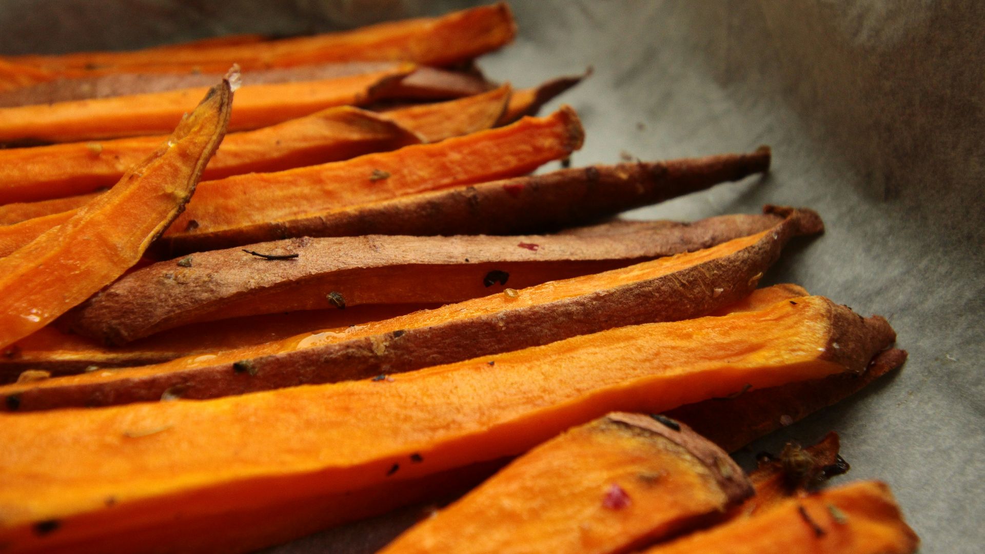 sliced carrots on stainless steel tray
