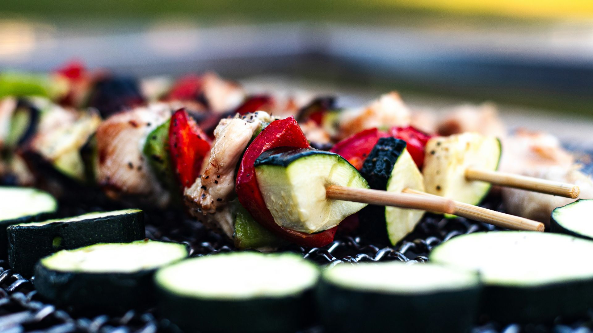 a close up of a plate of food with cucumbers