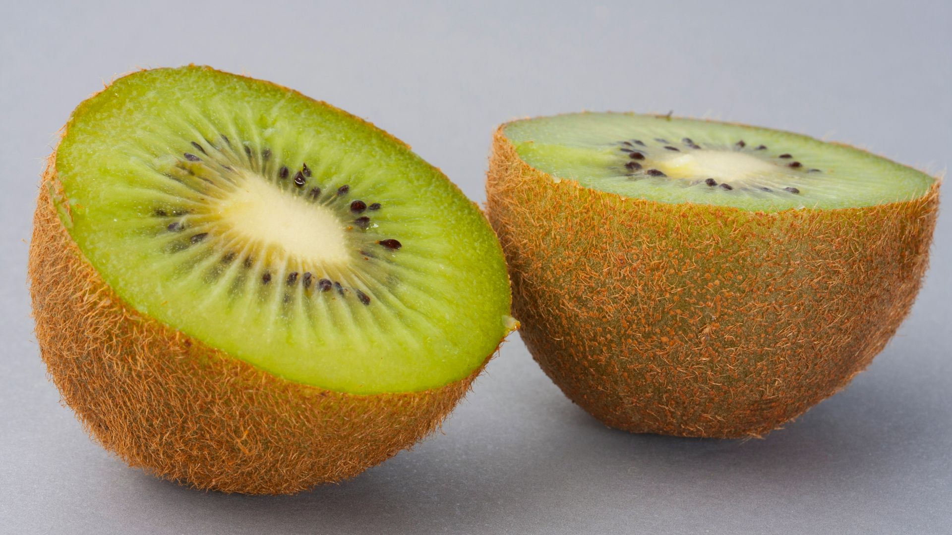 sliced green fruit on white surface