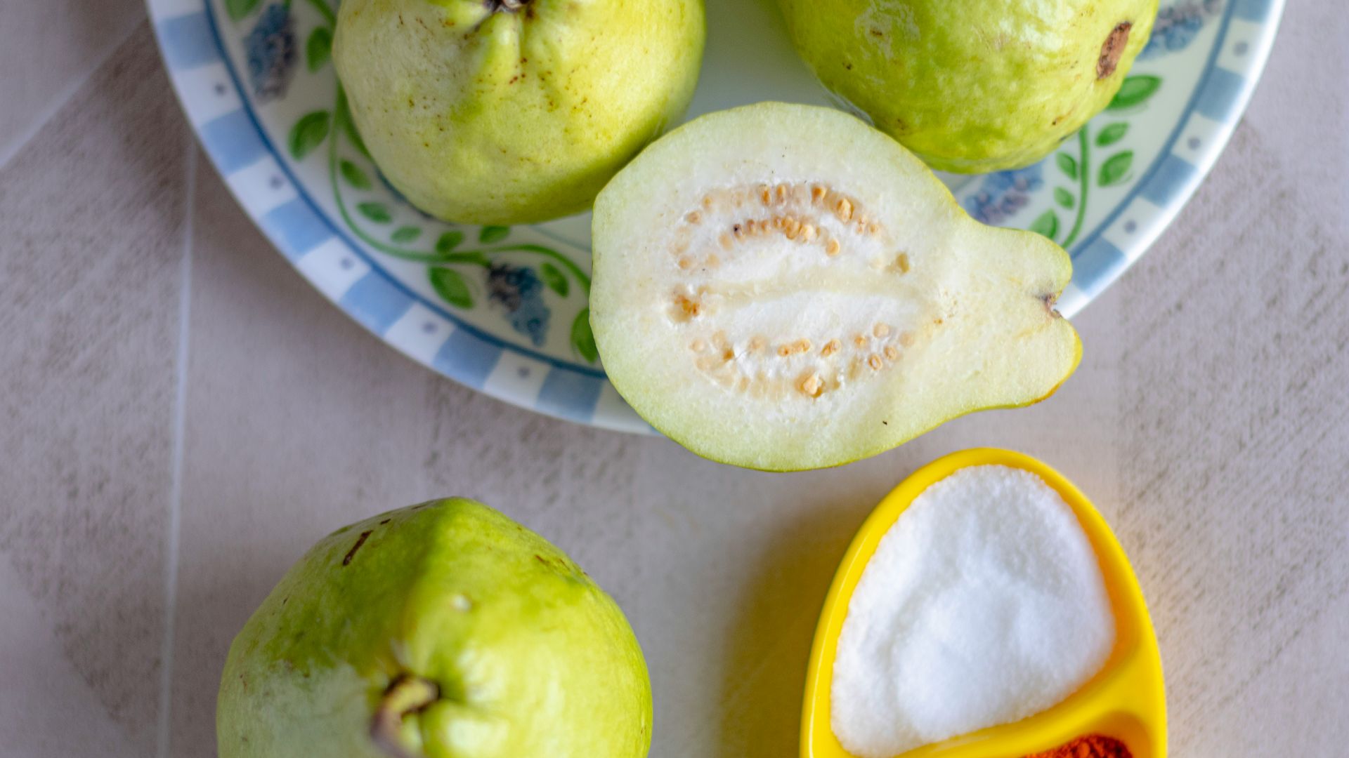 green apple fruit on white and blue ceramic plate