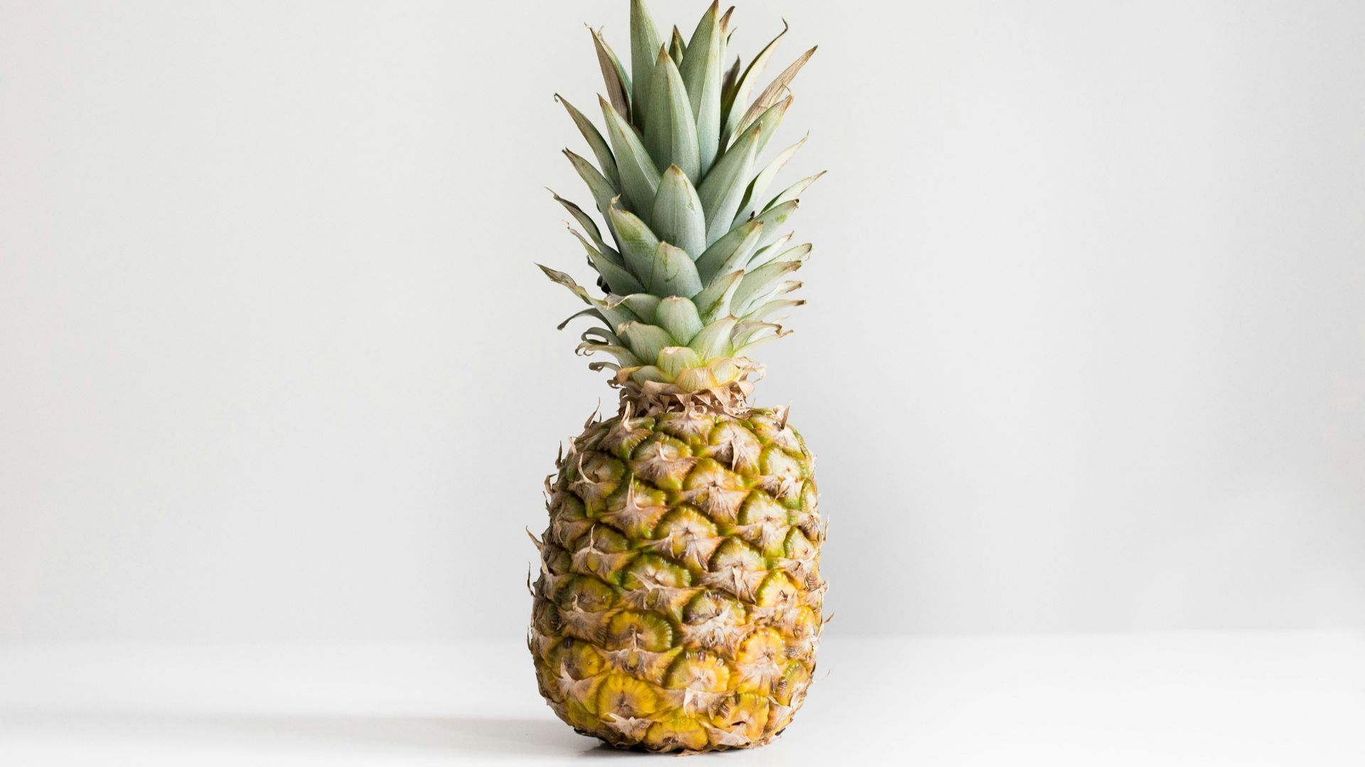 pineapple on white surface