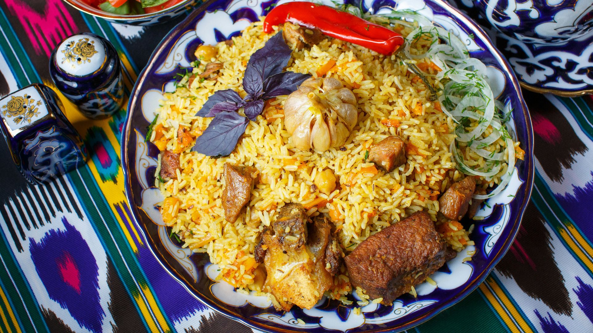 a plate of food on a colorful table cloth