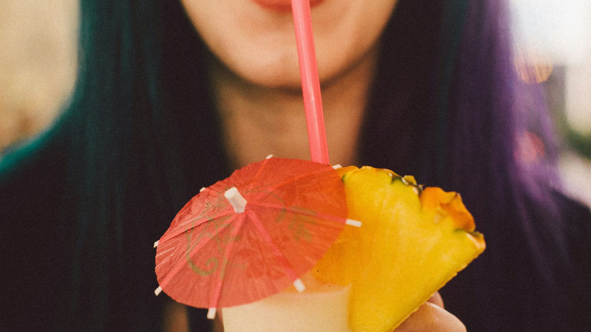 woman drinking shake using straw
