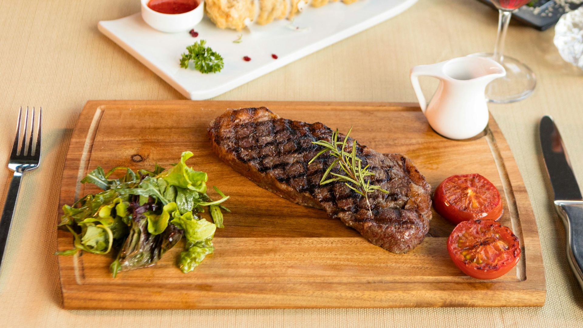 grilled meat on brown wooden chopping board