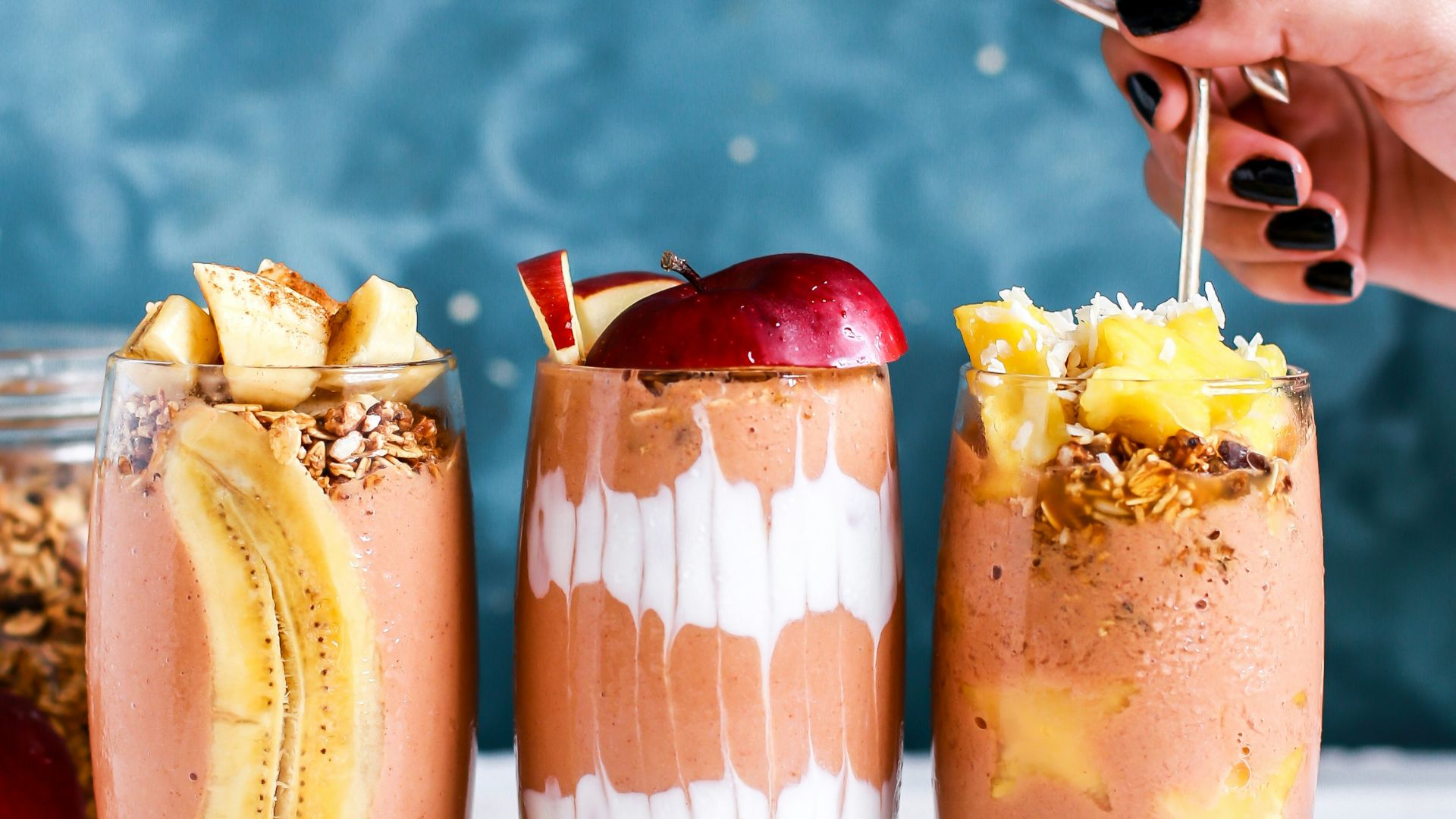 three clear drinking glass filled by shakes