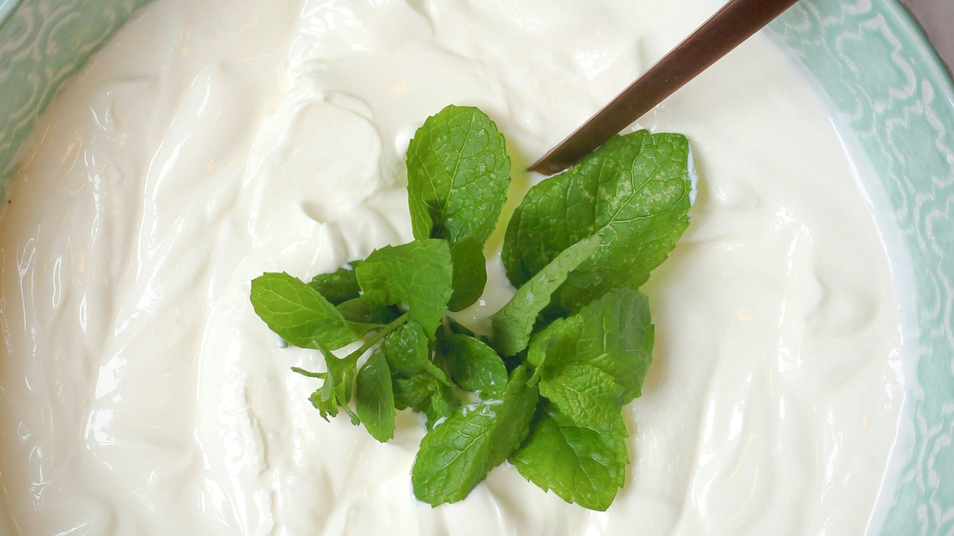 a bowl of yogurt with a spoon in it