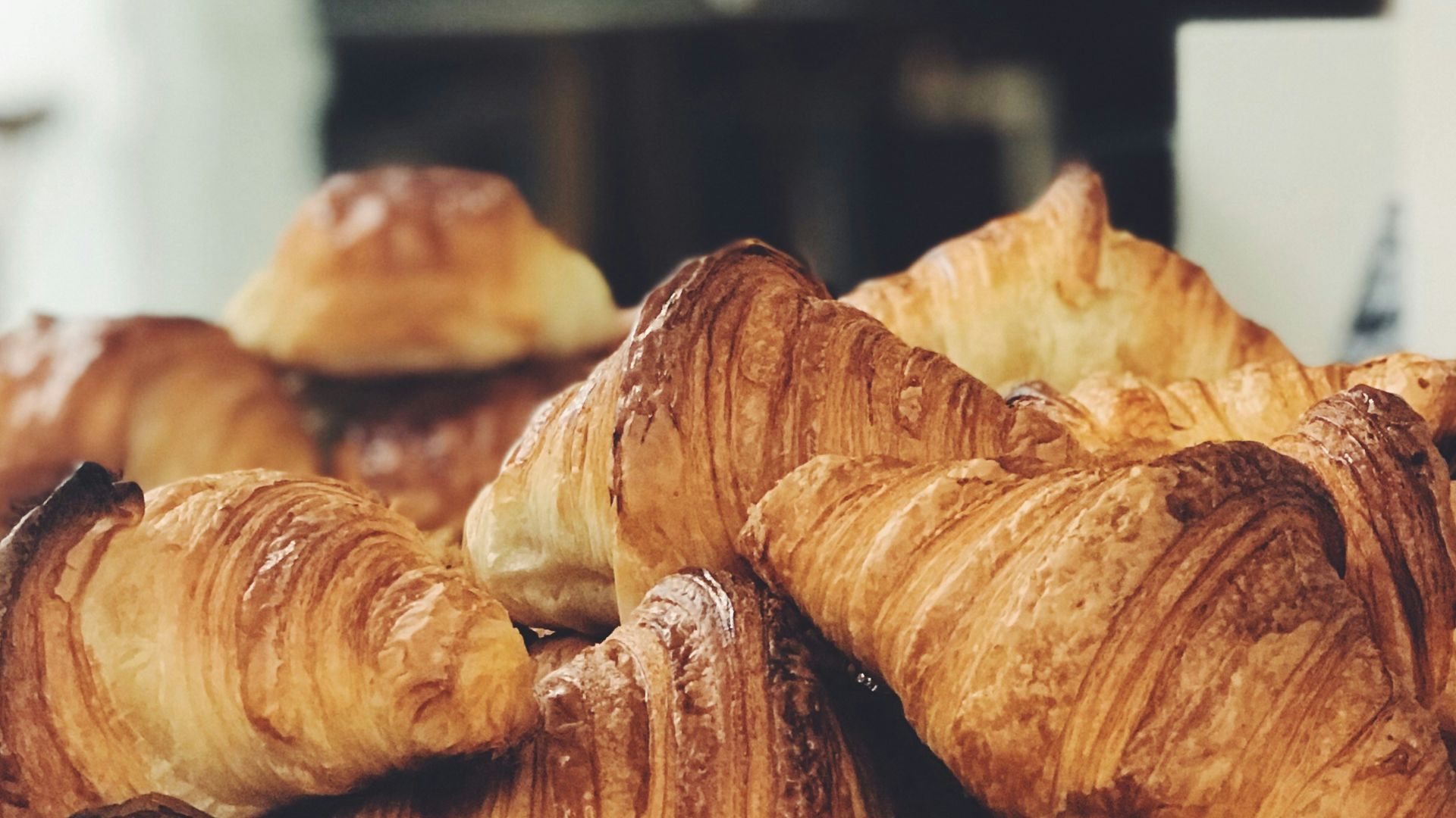 croissant on top of stainless steel tray