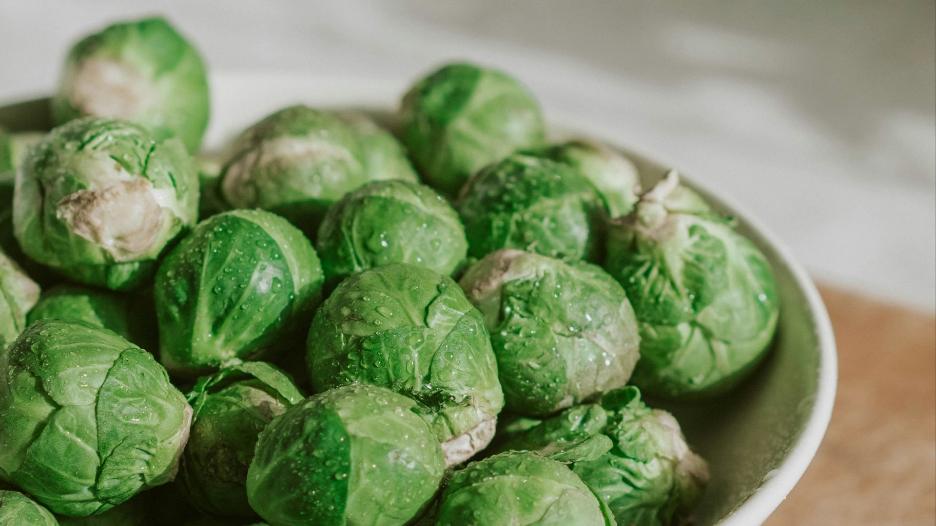 green vegetable on white ceramic bowl