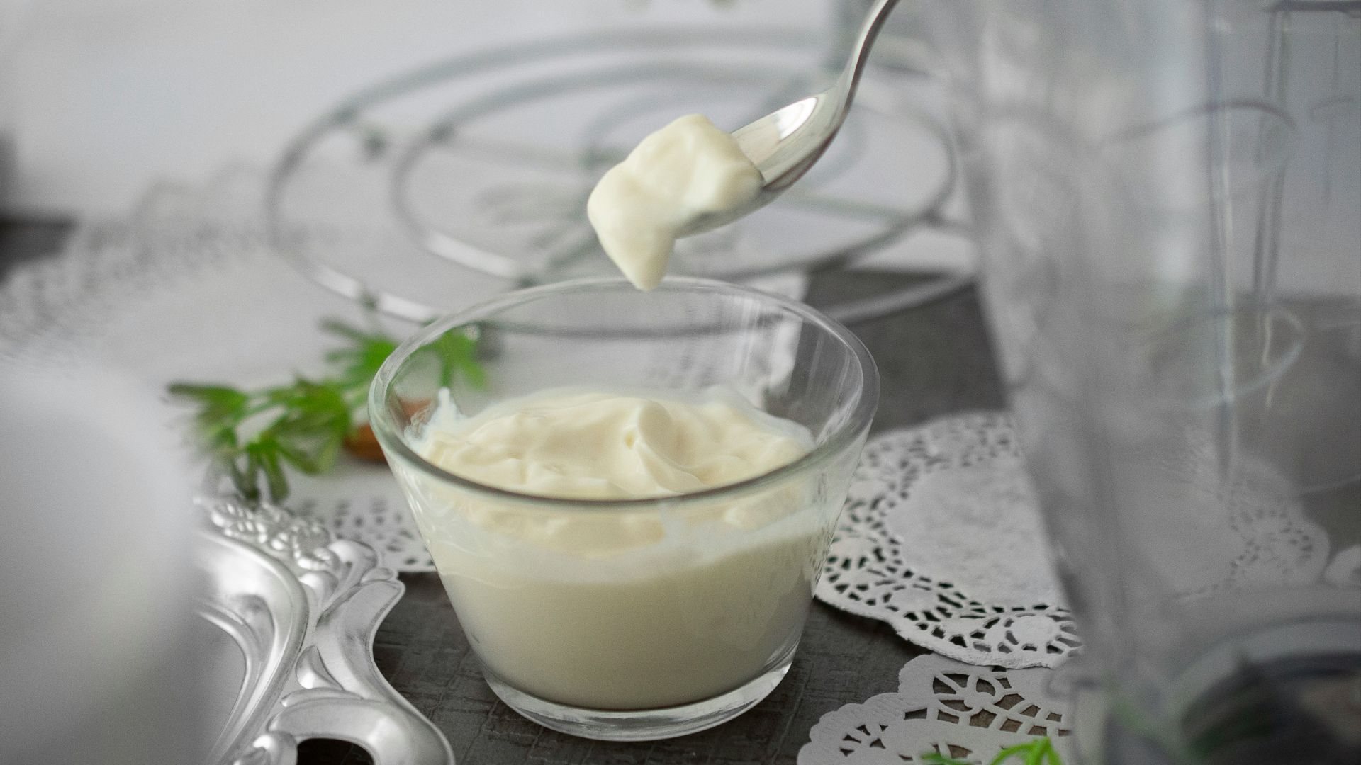 close-up photo of white cream in clear shot glass