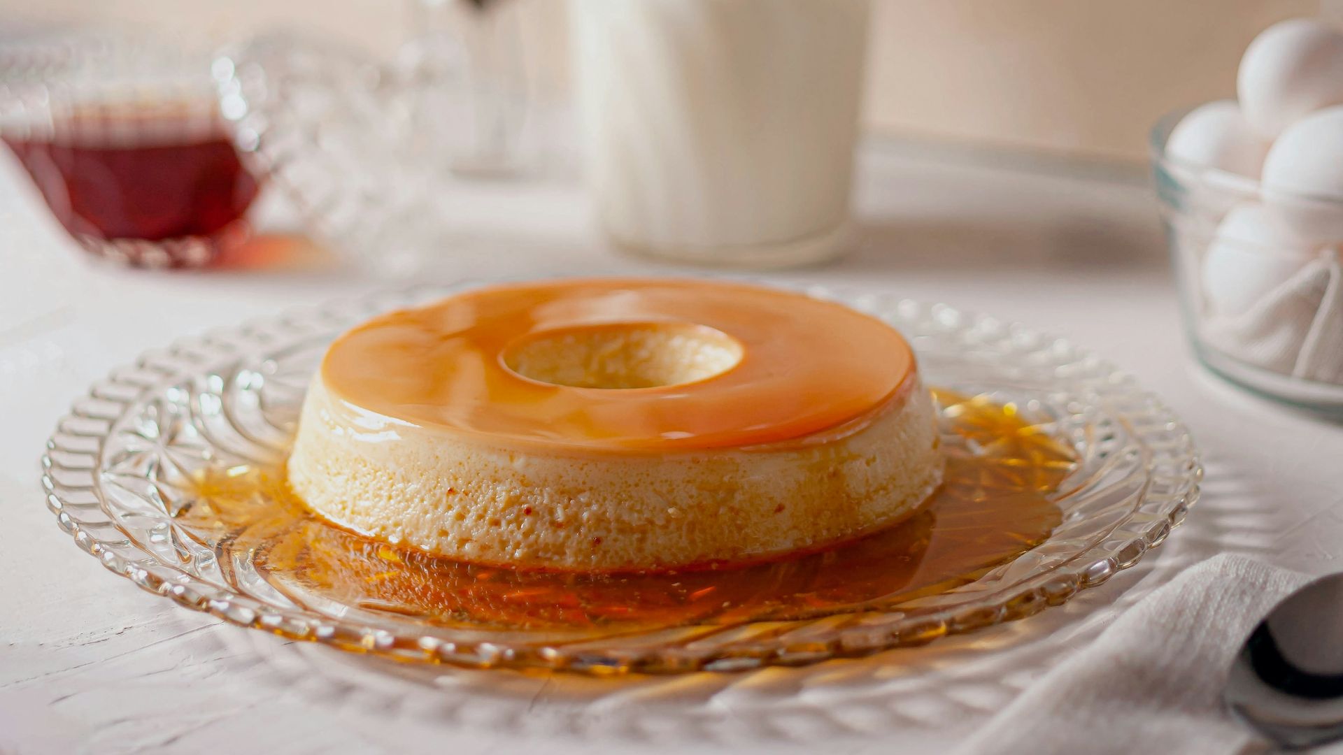 a table topped with a cake covered in frosting