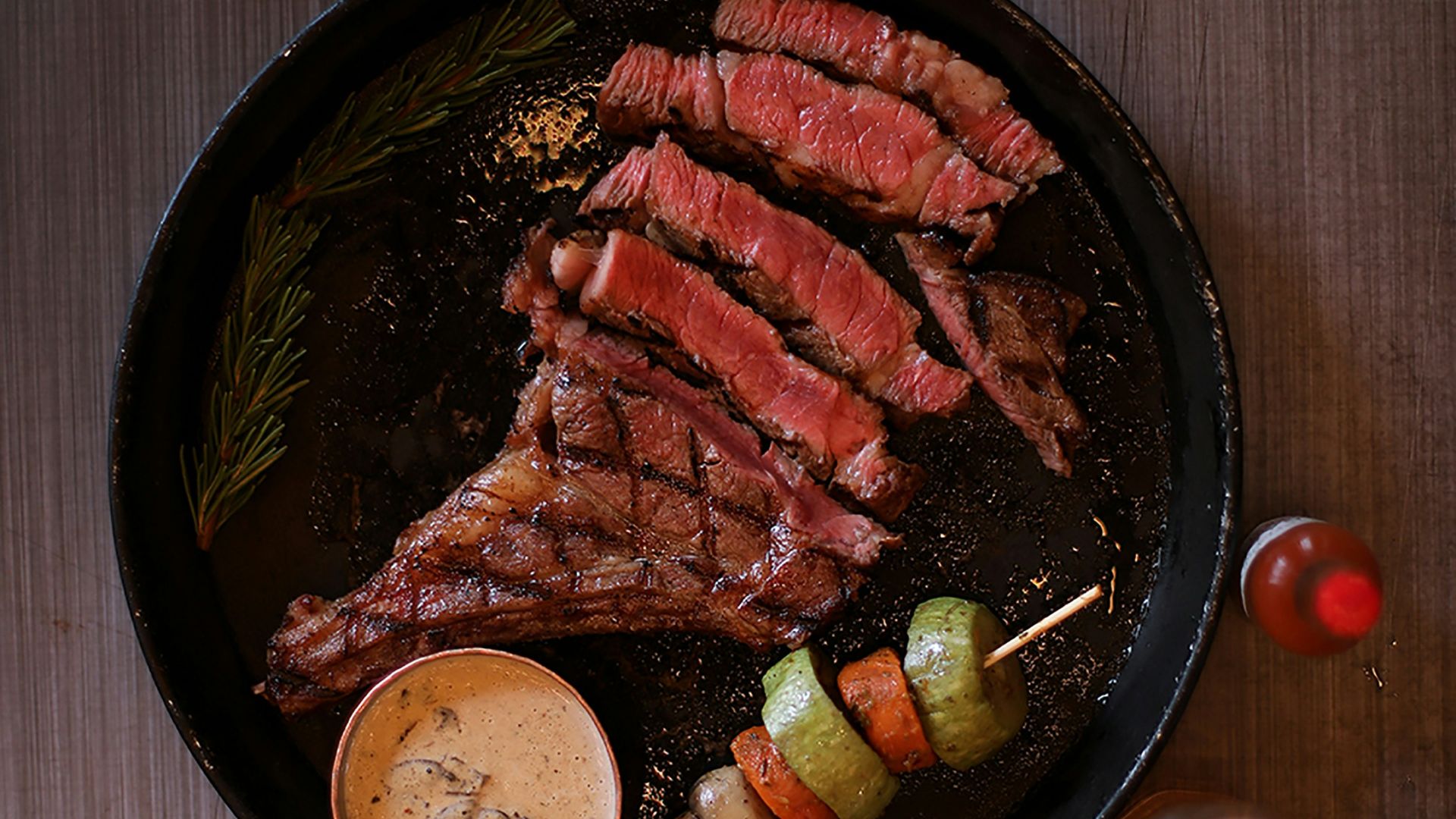 a plate of meat and vegetables on a table