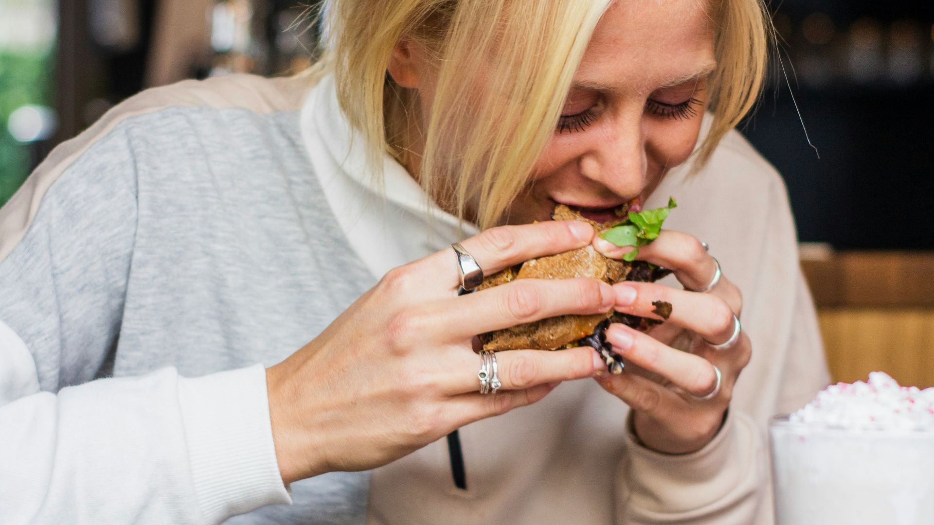 woman eating burger