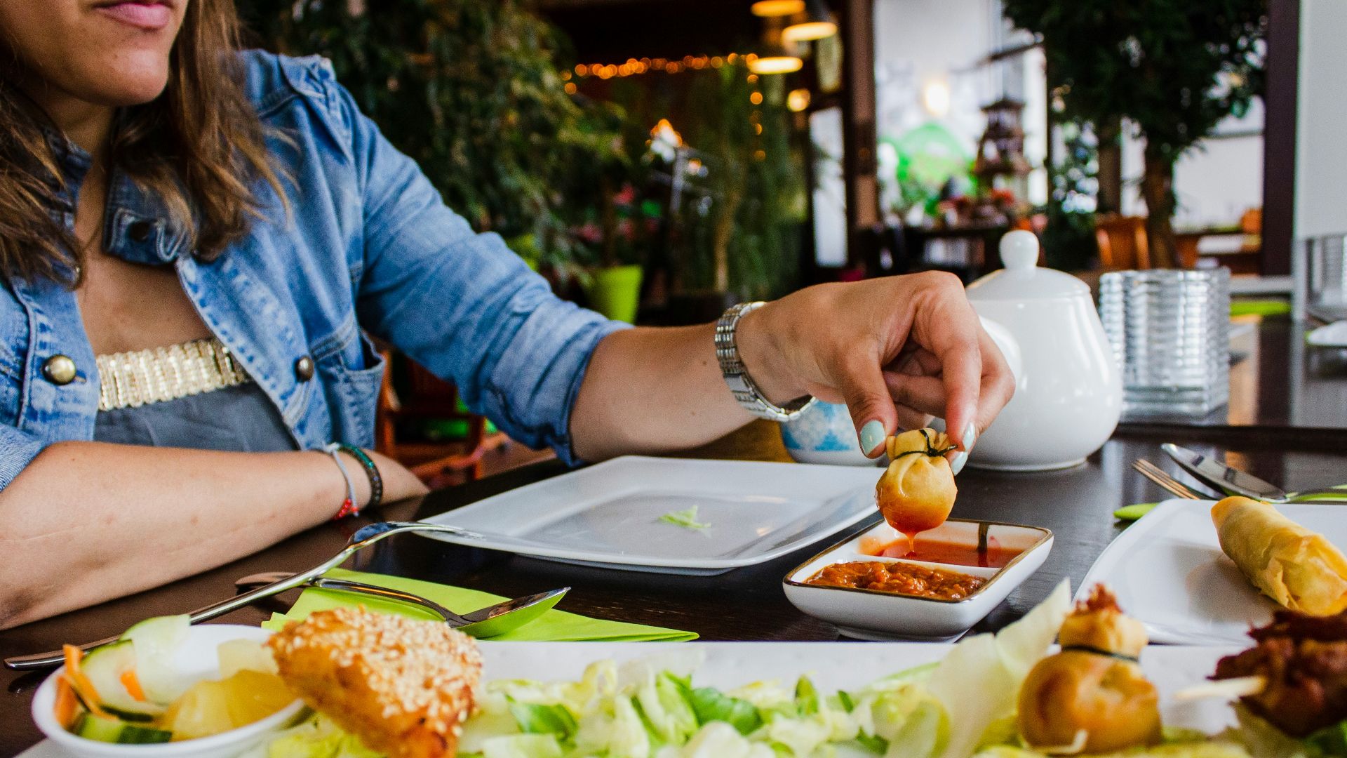 woman sits near table