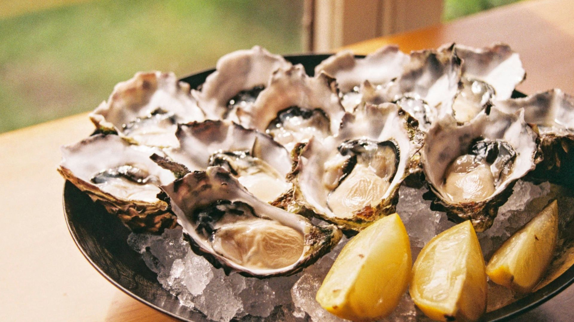 sliced lemon on black plate