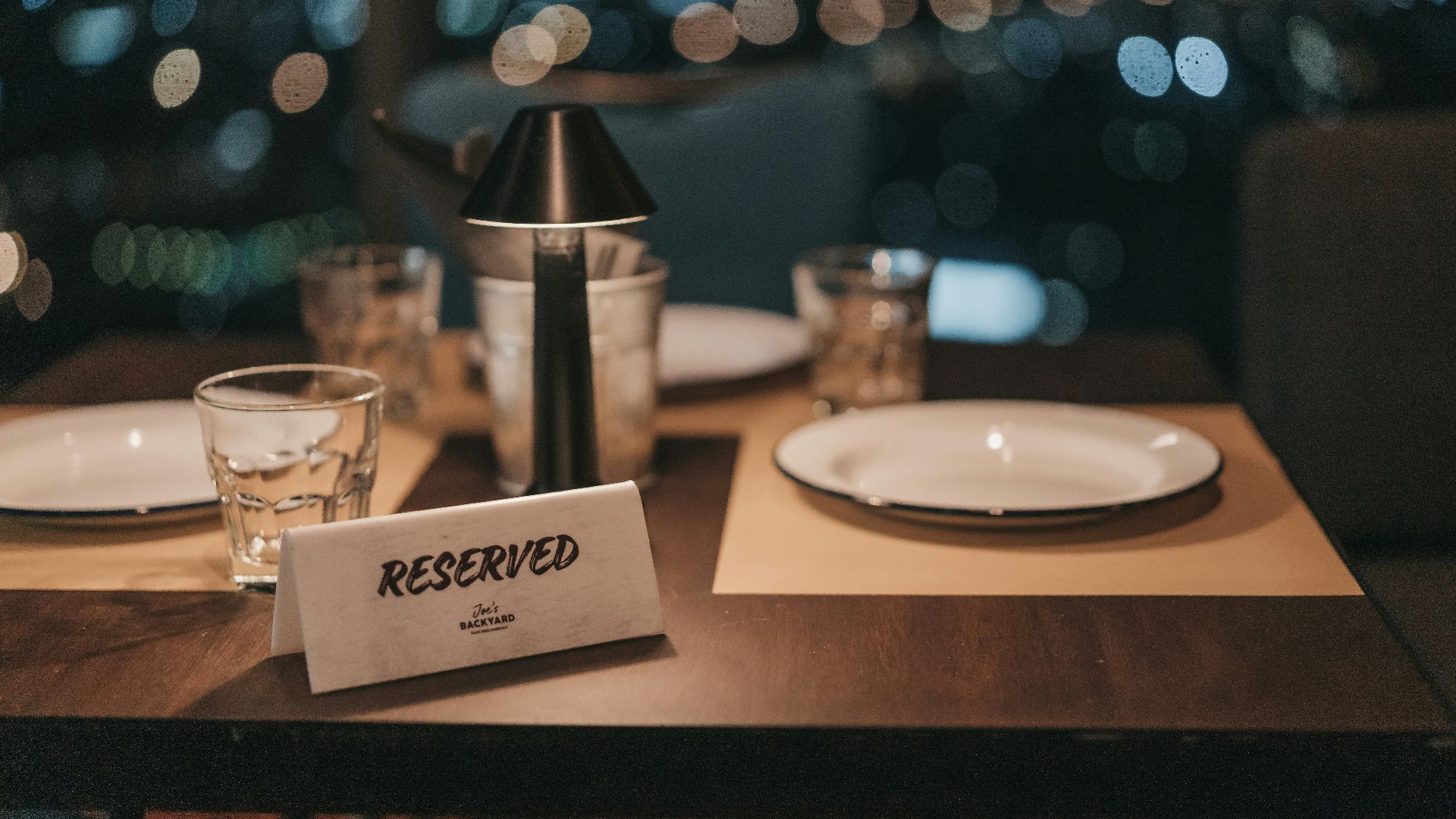 white ceramic plate on brown wooden table