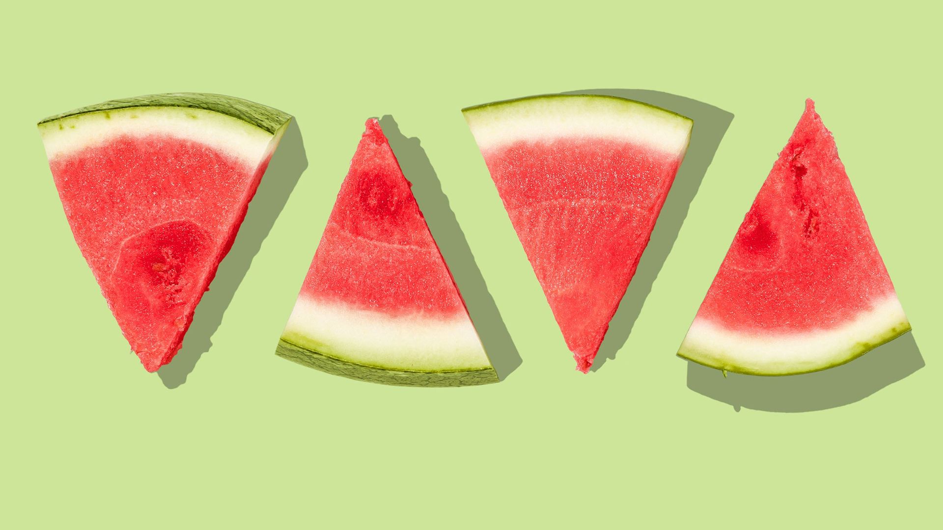 sliced watermelon with green background
