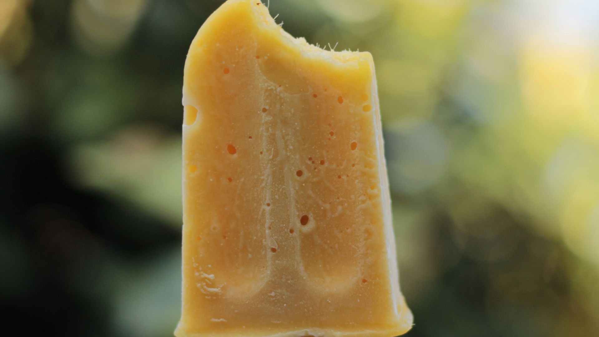 yellow ice cream in stick