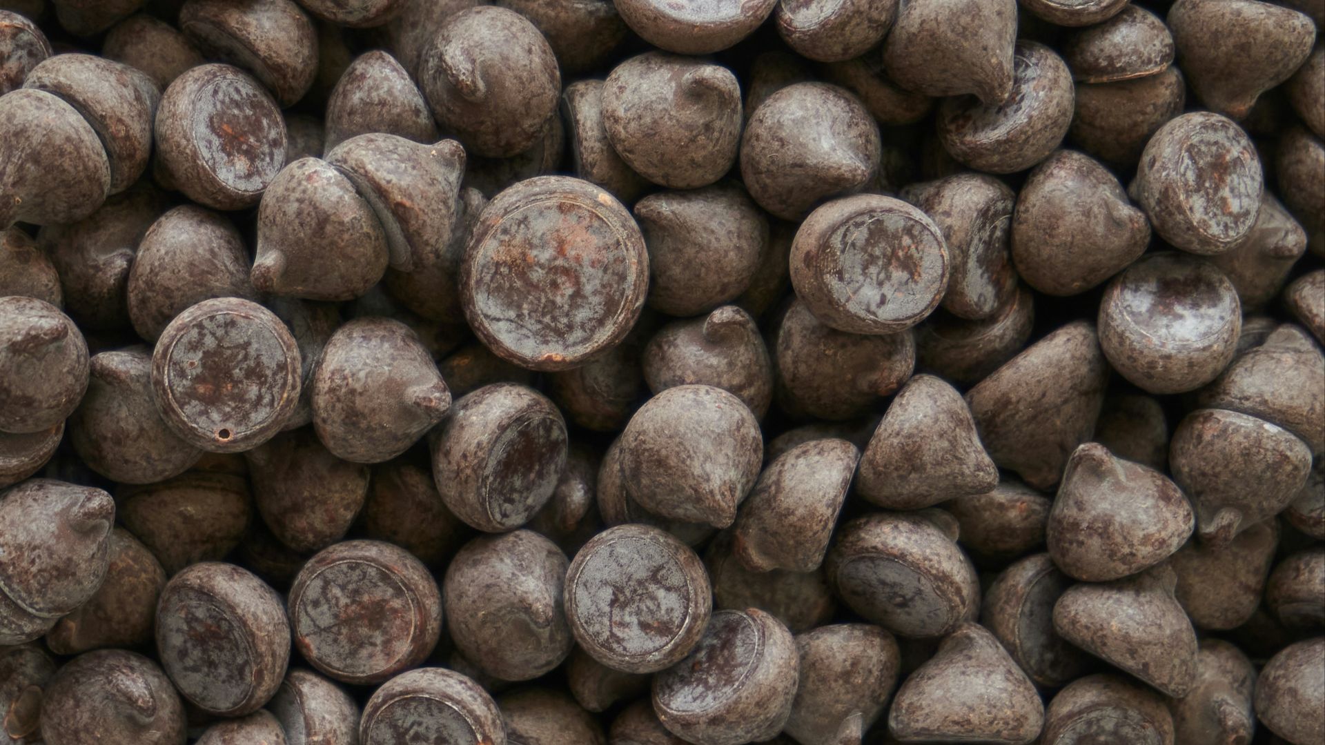 brown coffee beans on brown wooden surface