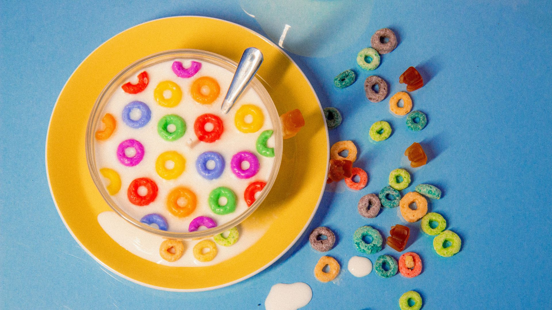 a bowl of cereal with a spoon on a plate