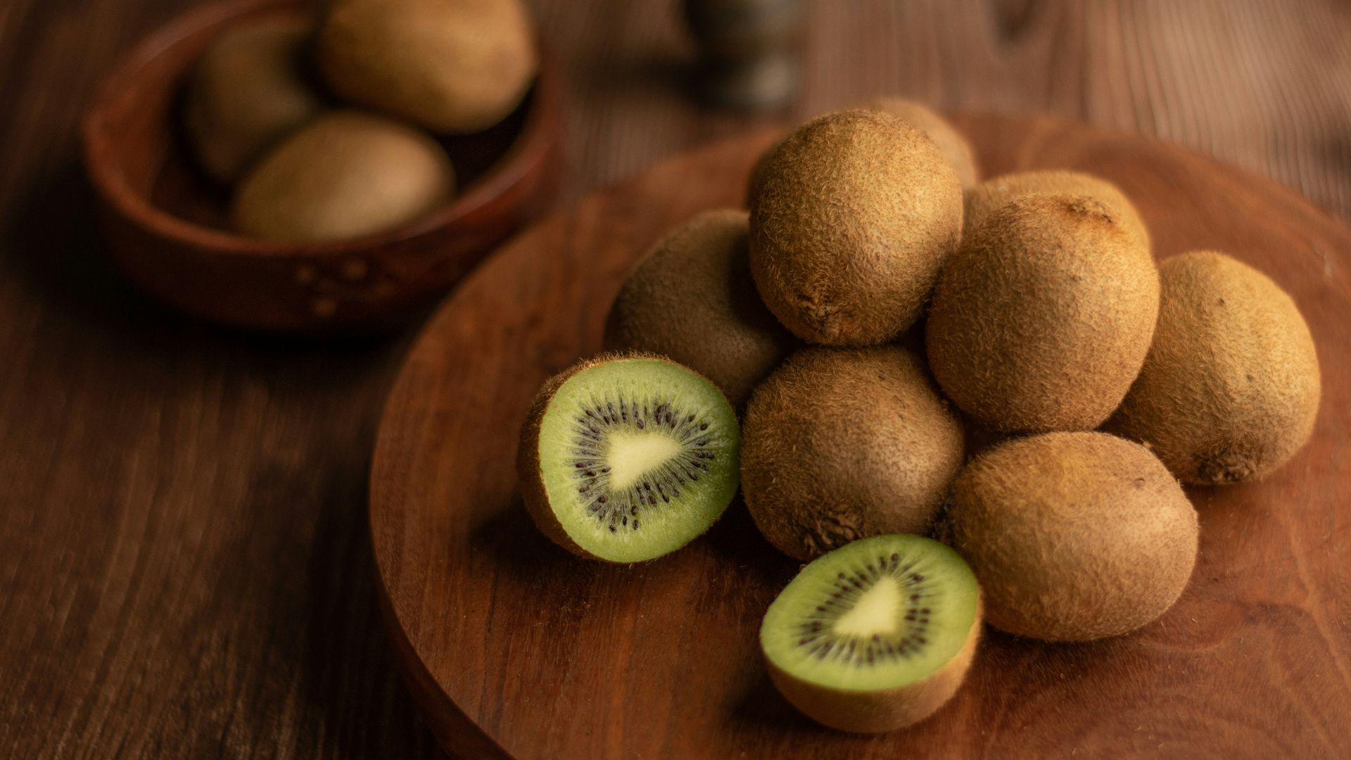 brown round fruit on brown wooden table