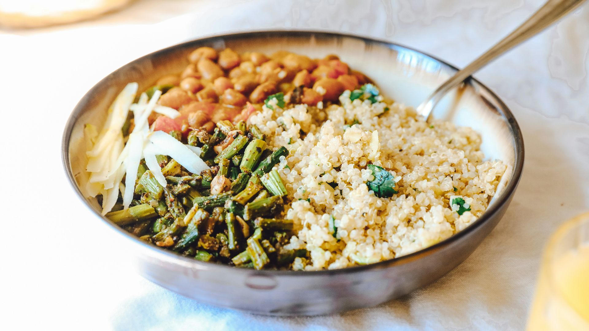 cooked rice with green peas and carrots on stainless steel bowl