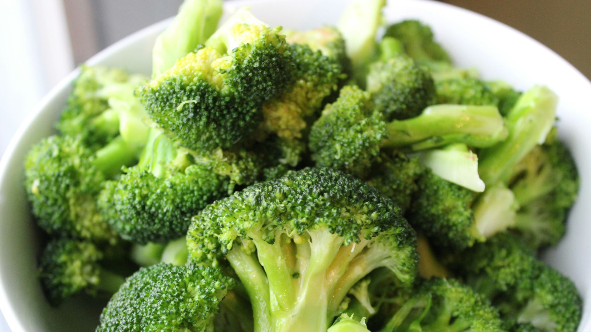 green broccoli on white ceramic plate