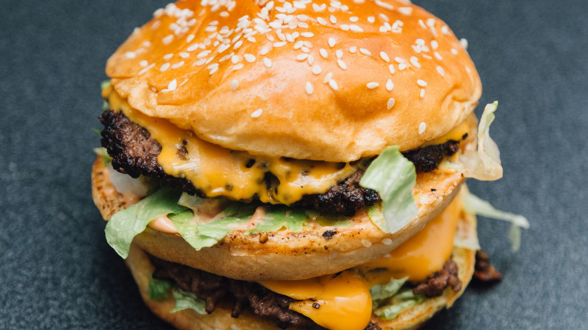 A hamburger sitting on top of a table