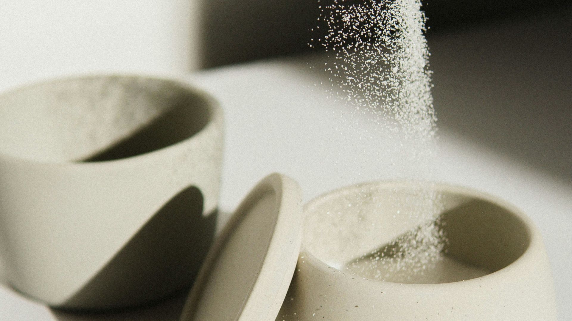 white ceramic bowl on white table