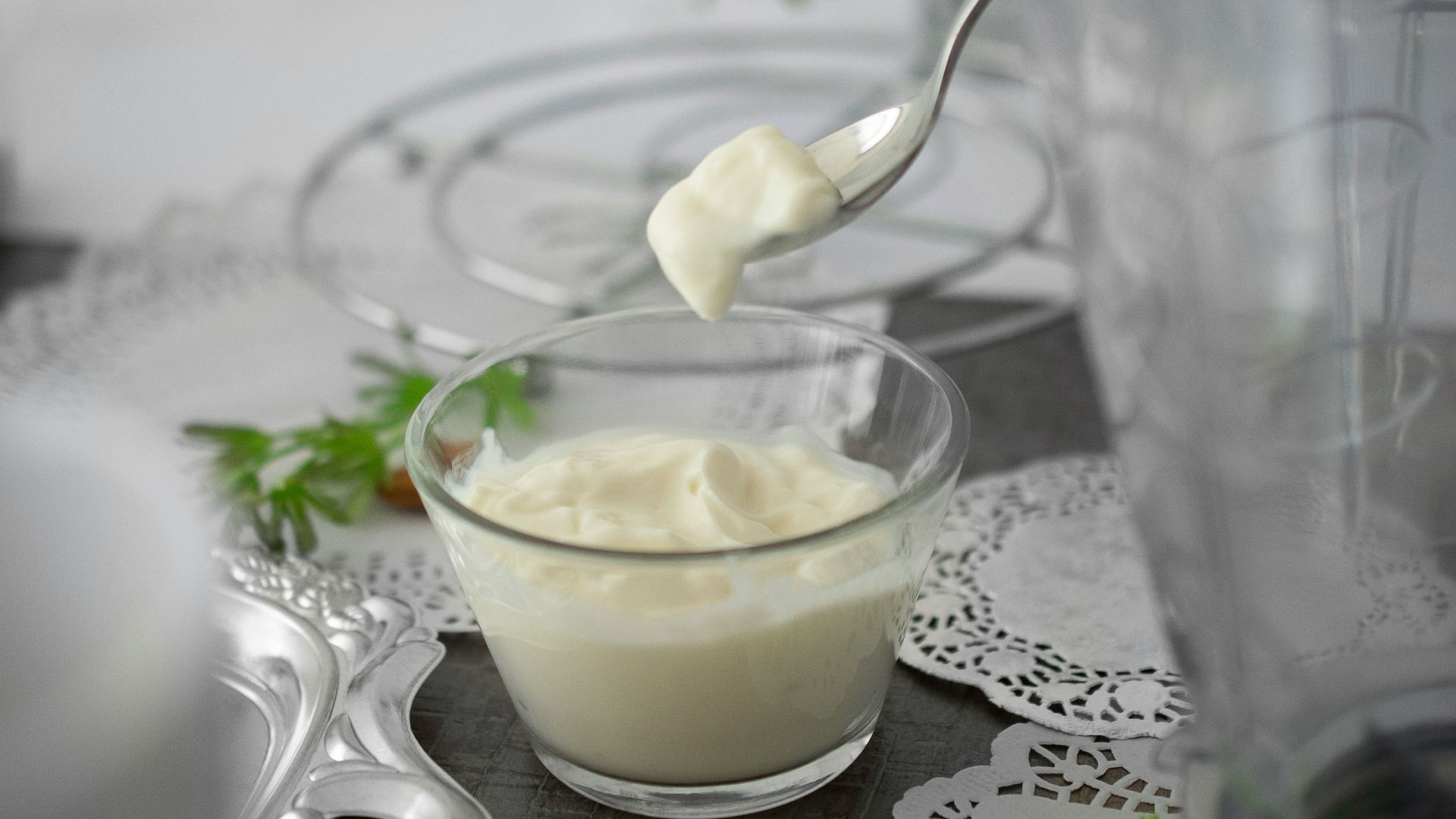 close-up photo of white cream in clear shot glass