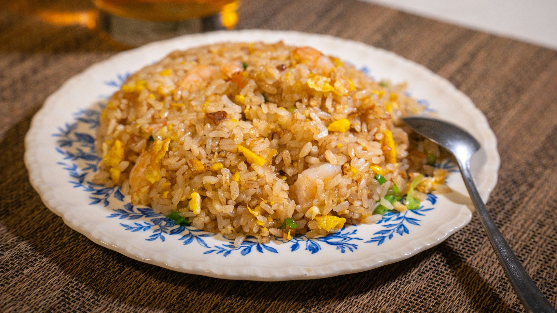white ceramic plate with rice and stainless steel fork