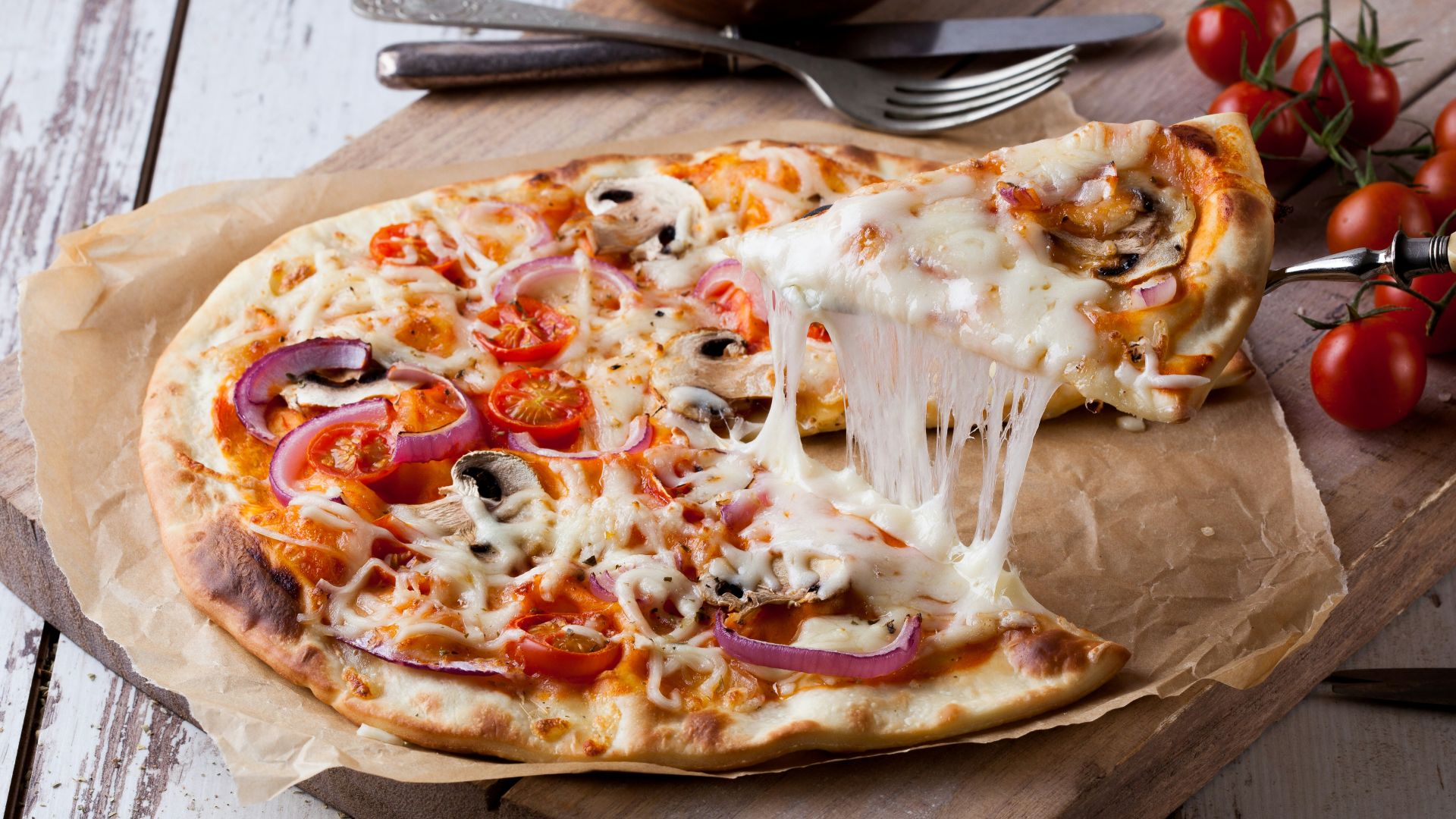 pizza on brown wooden tray