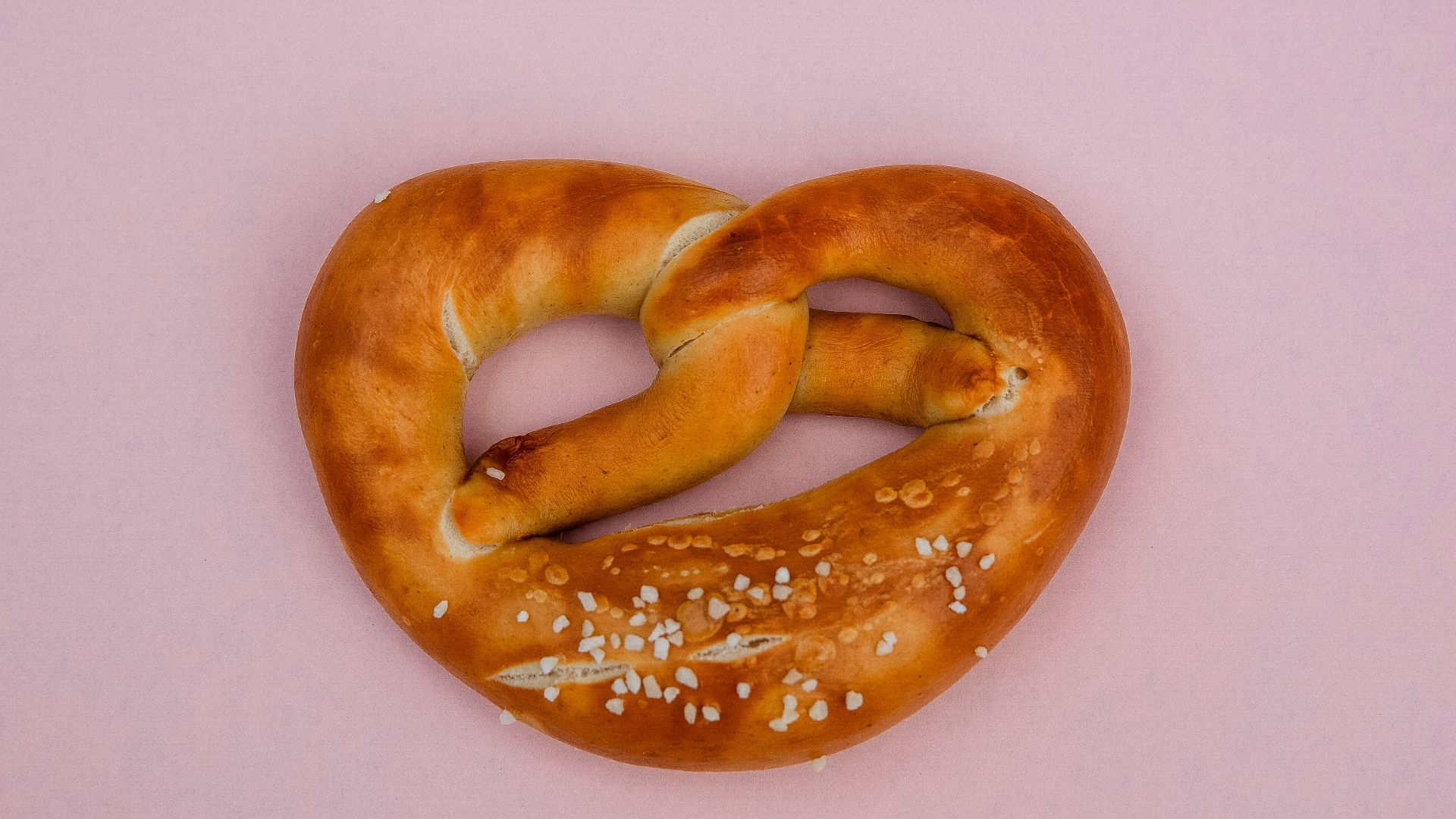 bread knot on pink surface