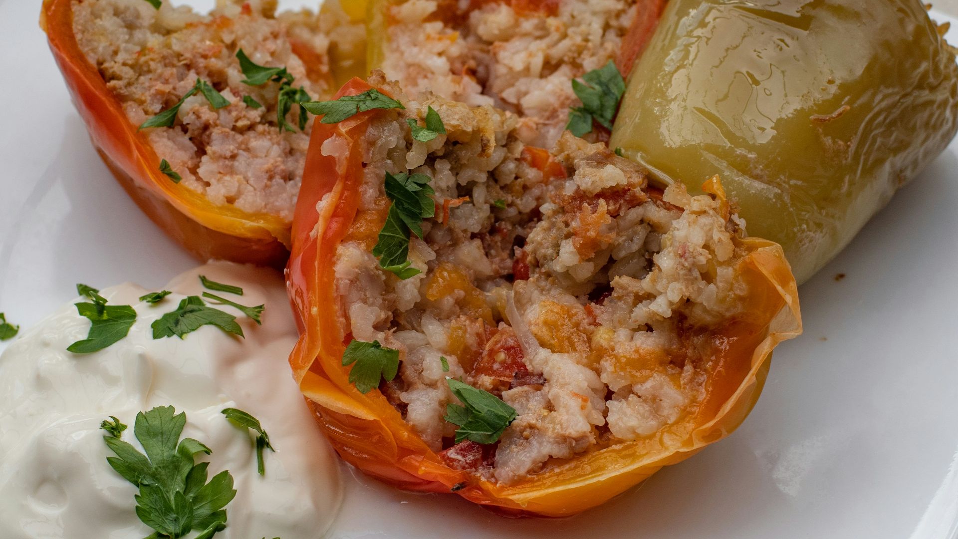 a white plate topped with stuffed bell peppers