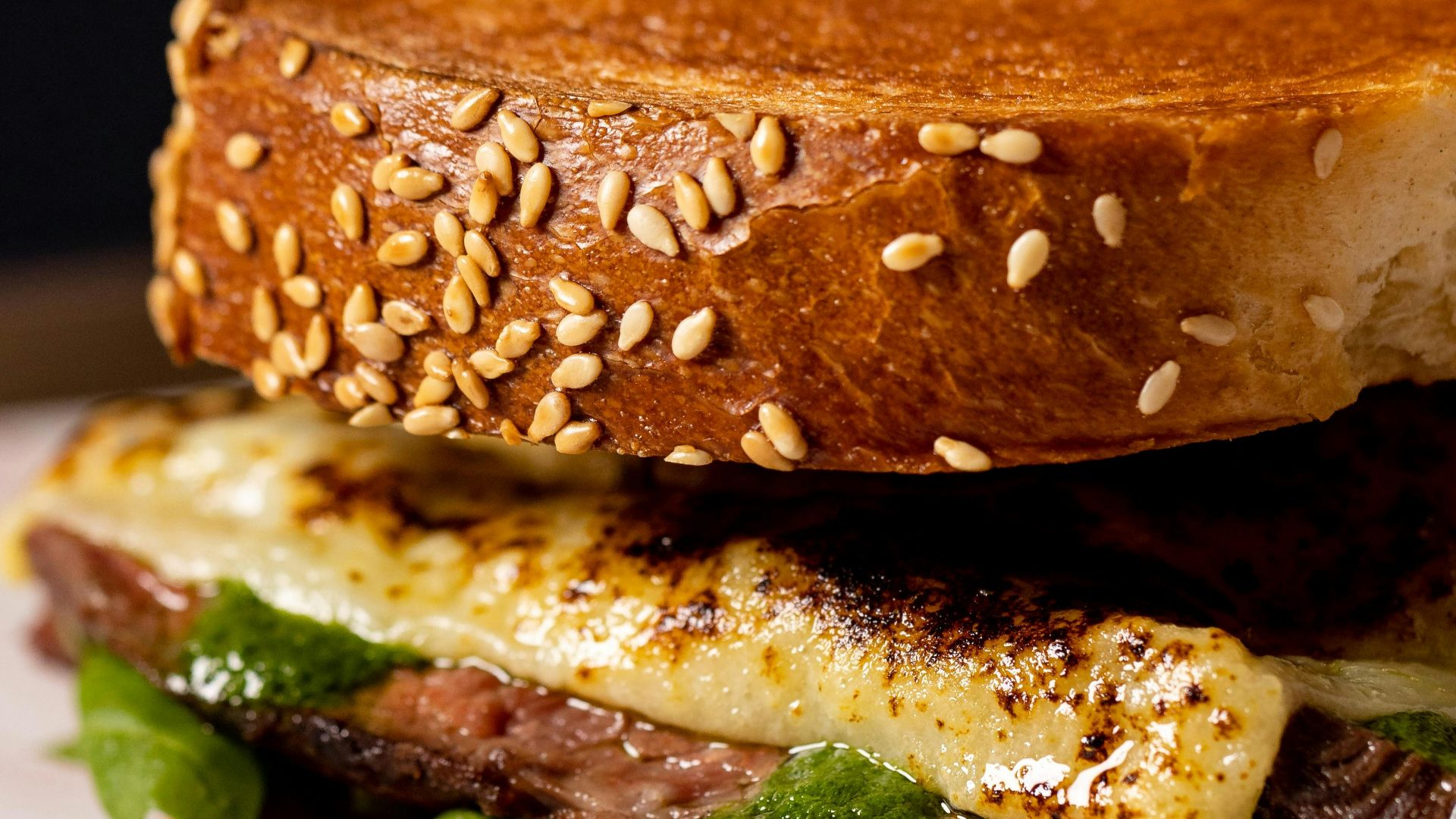 a sandwich with meat, cheese, and lettuce