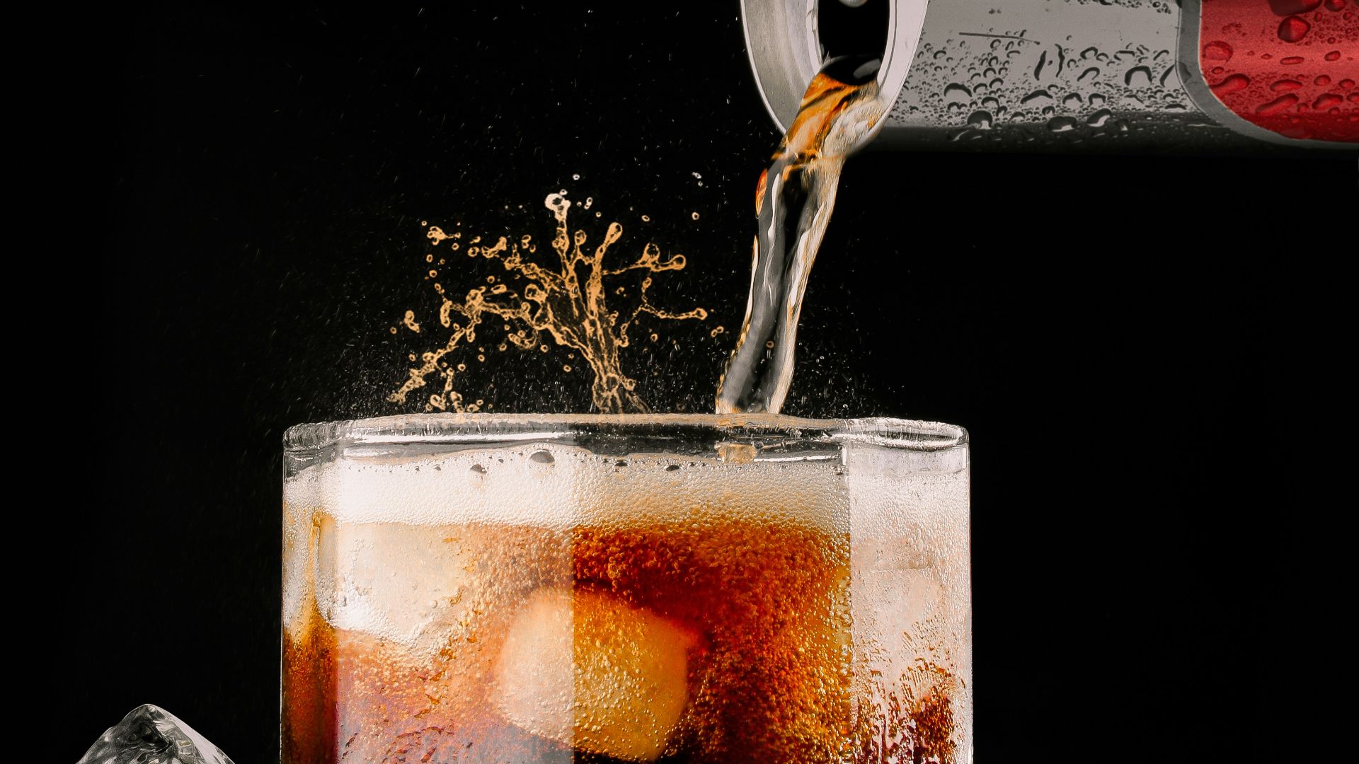 clear drinking glass with brown liquid