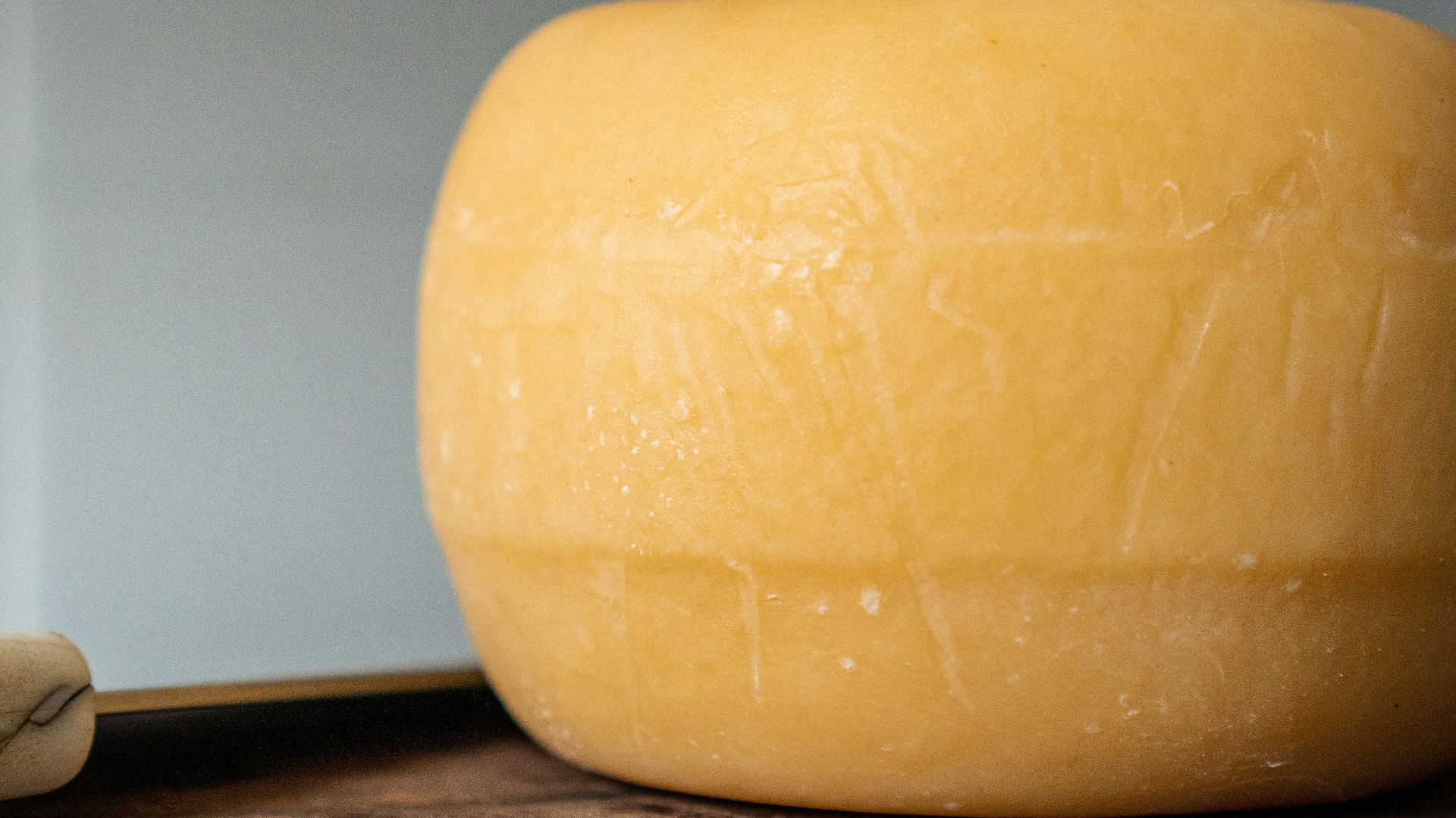 yellow plastic container on brown wooden table
