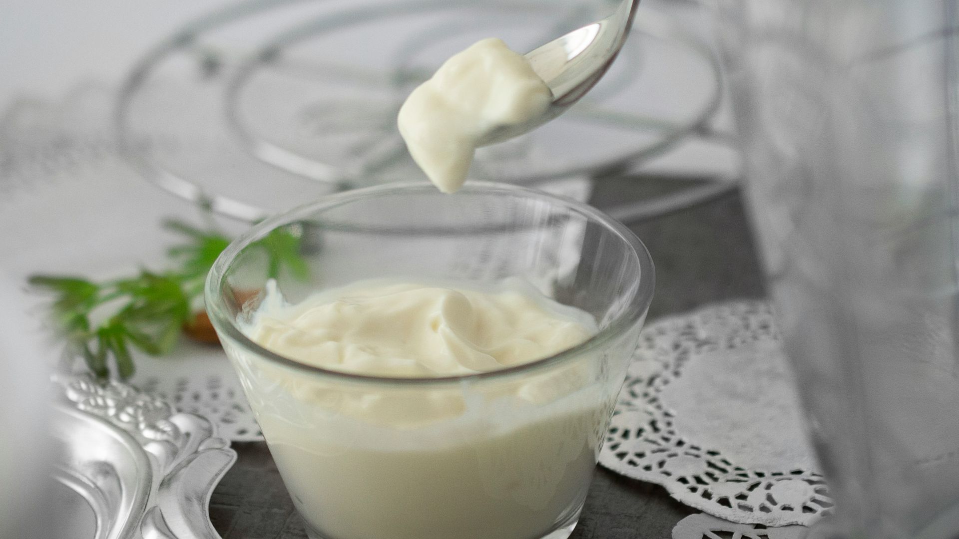 close-up photo of white cream in clear shot glass