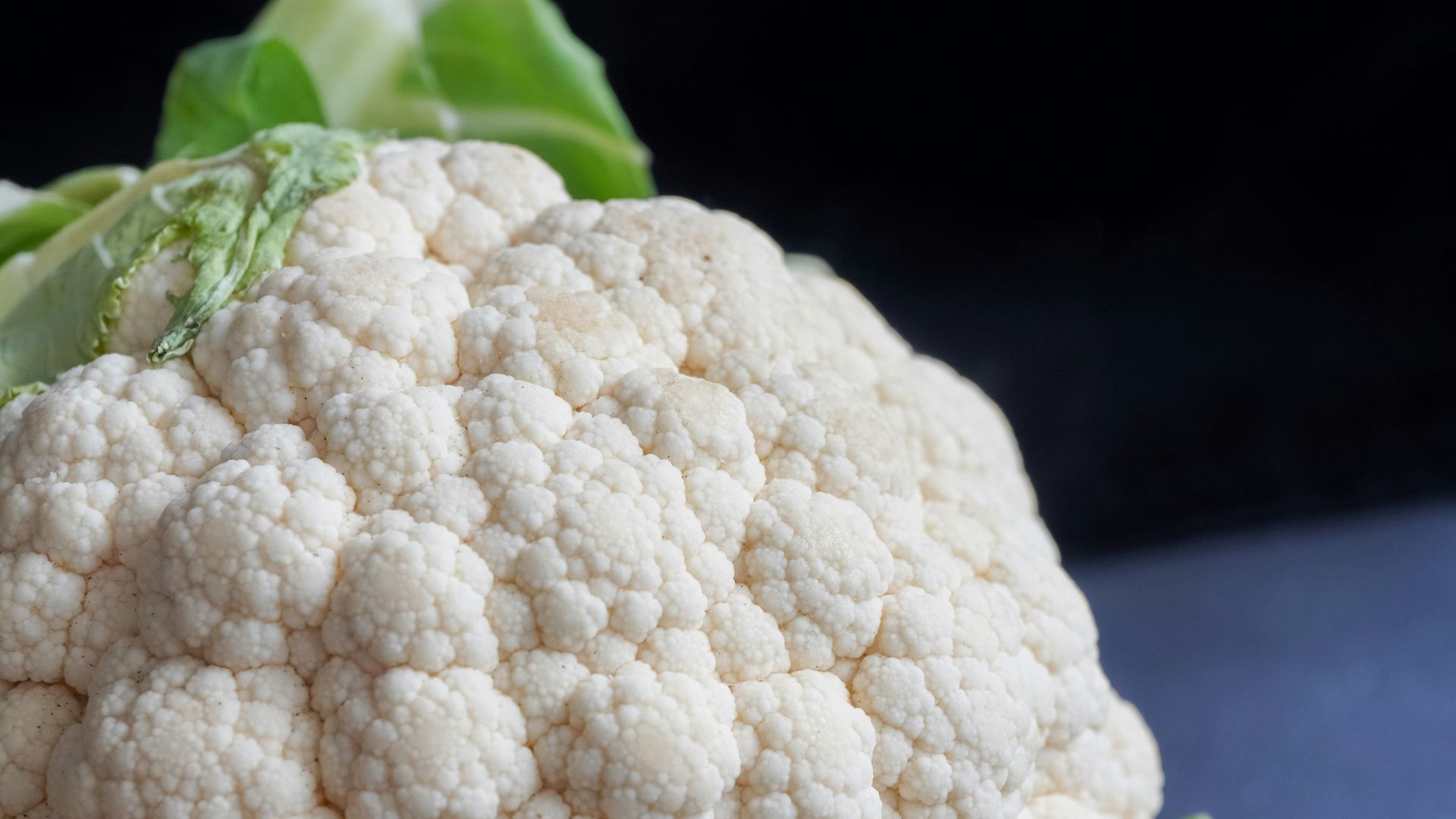 white cauliflower on black textile