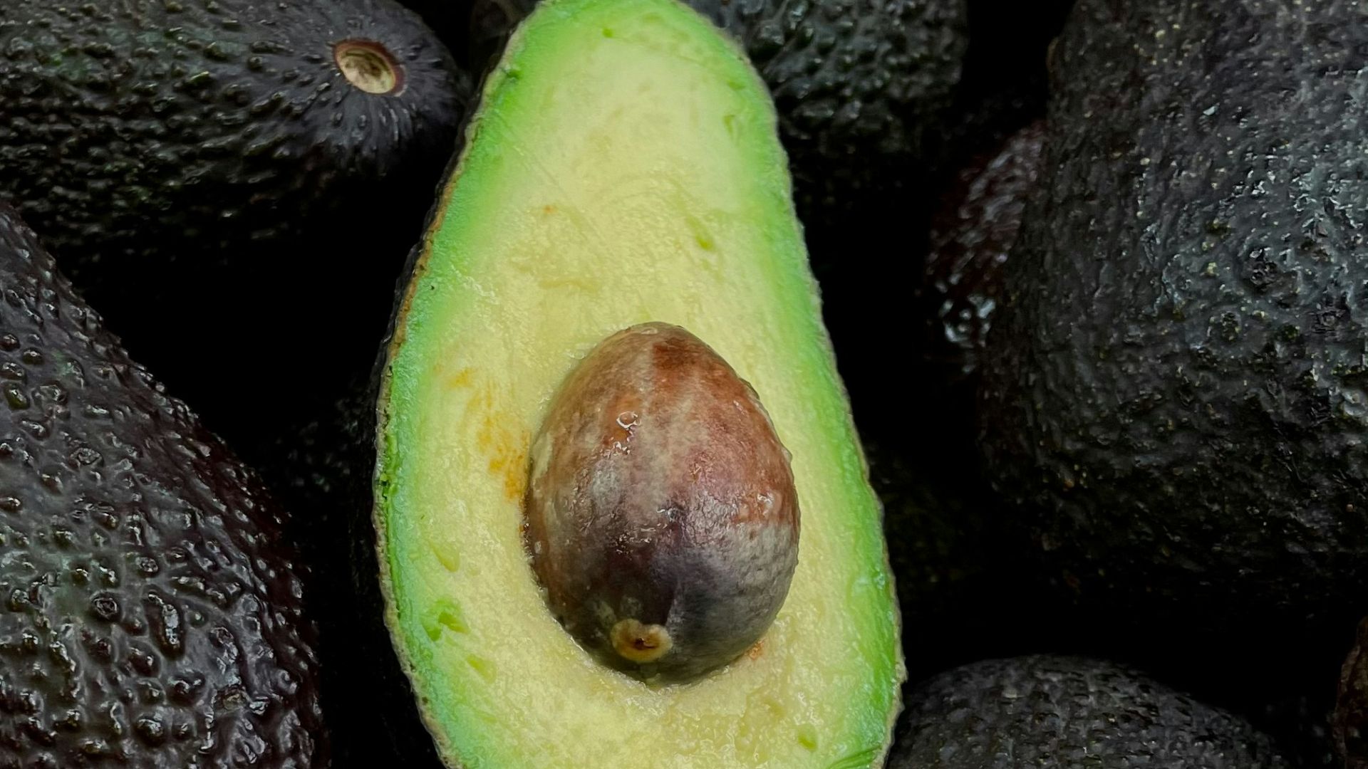 green and brown fruit on black and brown fruits