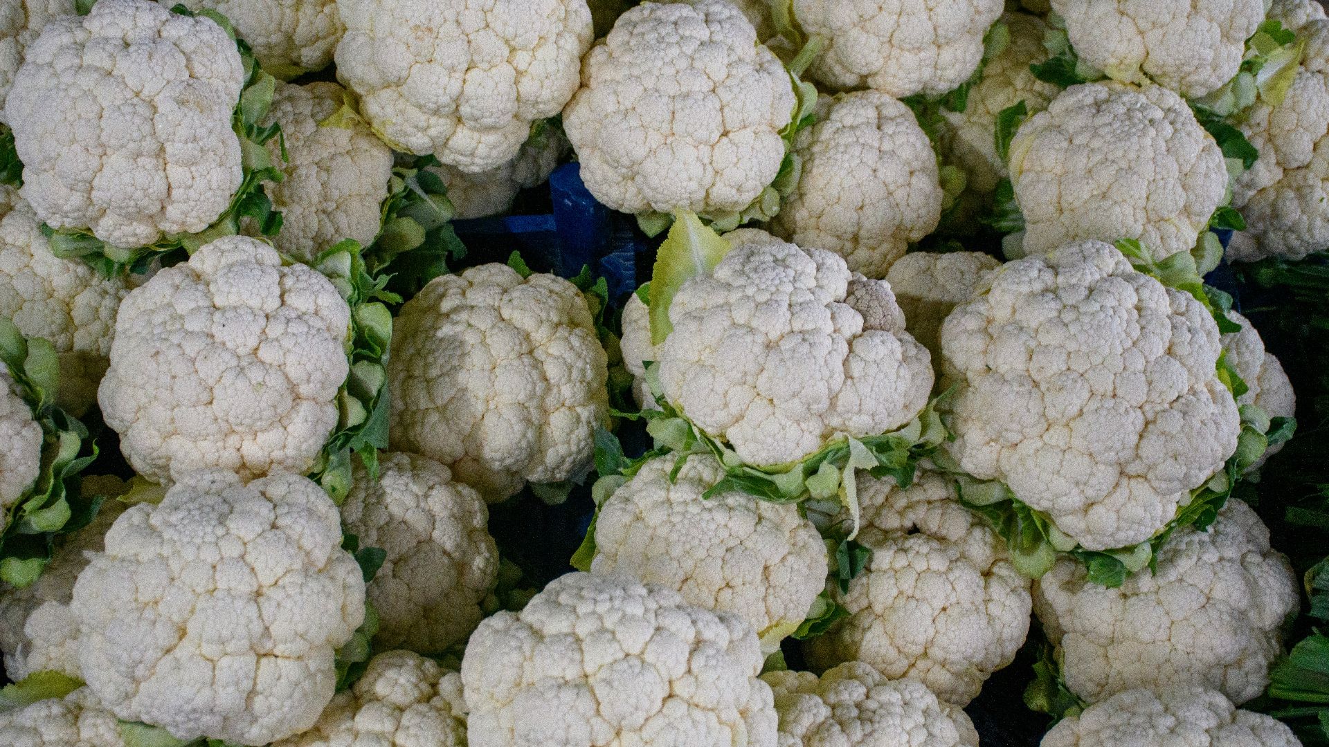 a bunch of cauliflower is piled on top of each other
