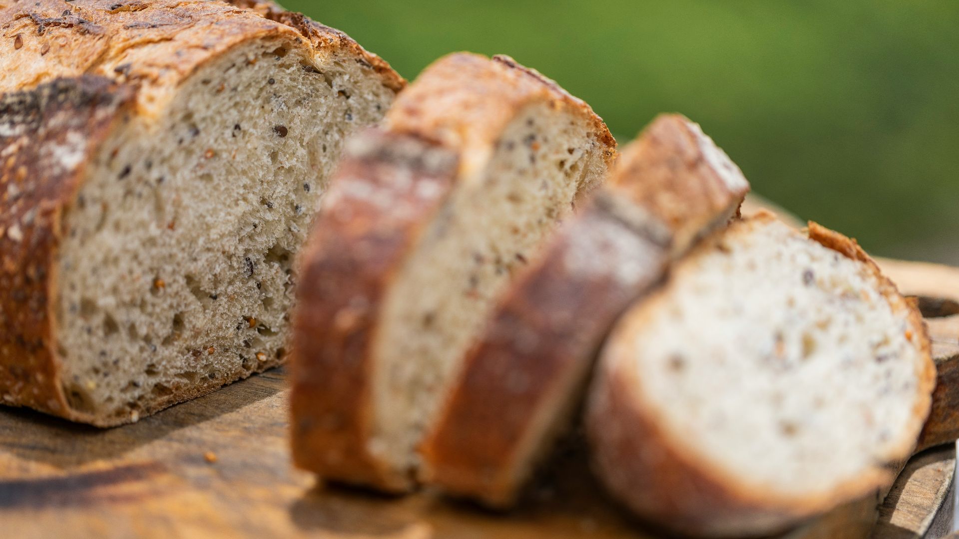 a loaf of bread sitting on top of a cutting board