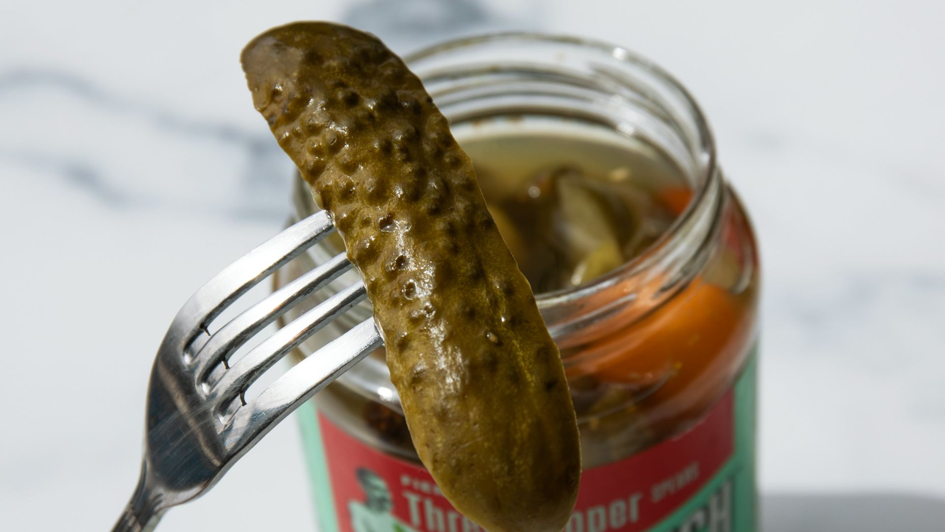 stainless steel fork on green labeled can