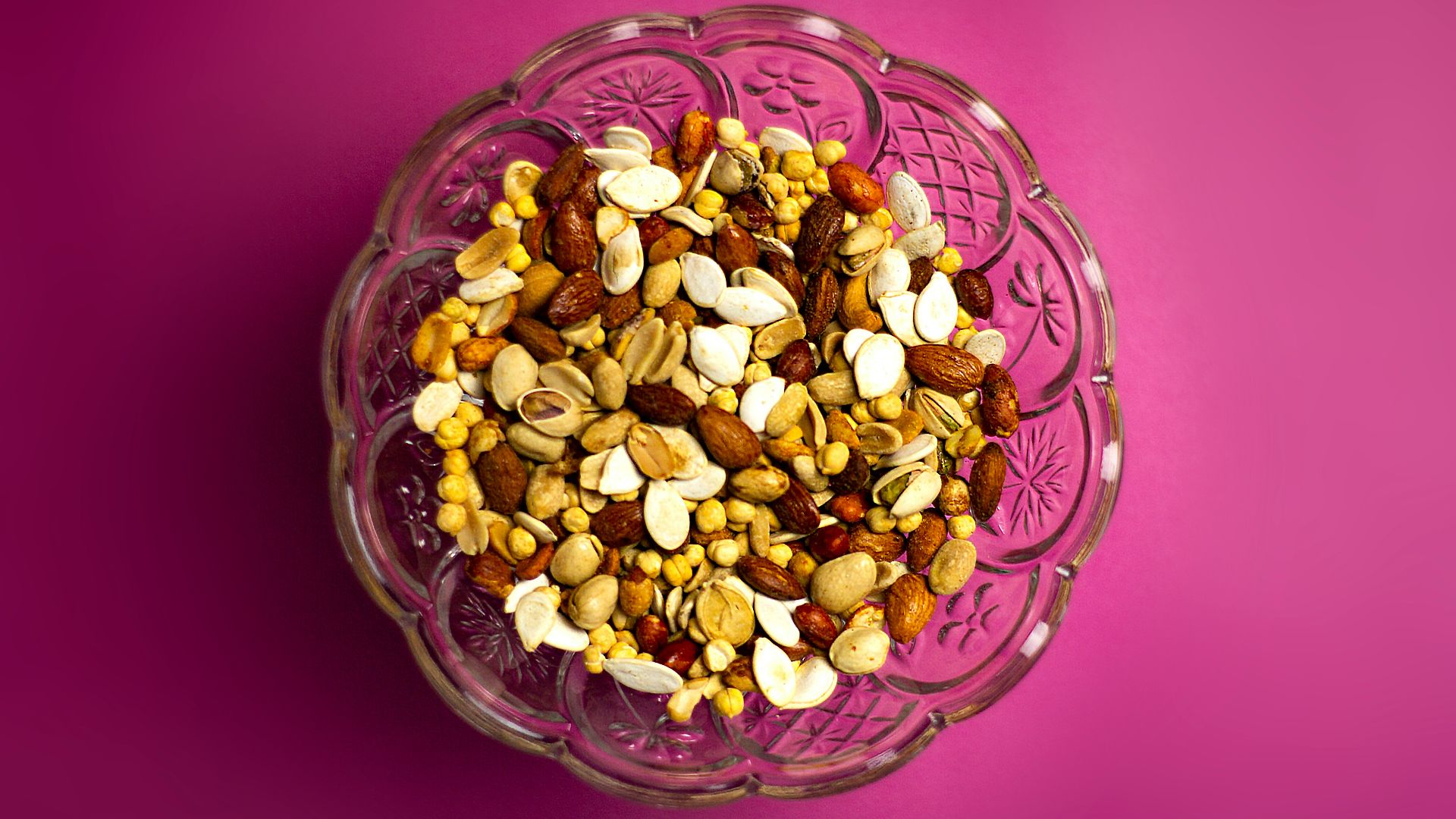 brown and white nuts on clear glass bowl